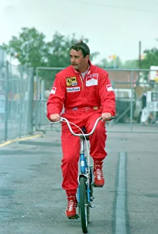 Motor Sports Prints: NIGEL MANSELL ON A BIKE AT THE FORMULA 1 BRITISH GRAND PRIX AT SILVERSTONE - July 1989