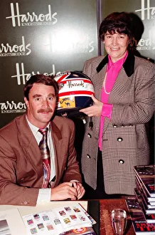 Harrods Prints: NIGEL MANSELL AND WOMAN AT HARRODS PROMOTION HOLDING A DRIVING HELMET 08 / 12 / 1992