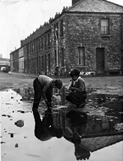 Raining Prints: To Nigel Morris and Leslie Hughes the old bombed patch at the top of Galston Street