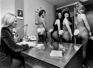 Night Clubs. Bunny Girls in the office having their tails looked
