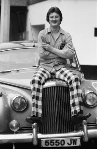 Nineteen year old dart player Eric Bristow poses in London sitting on top of a Rolls