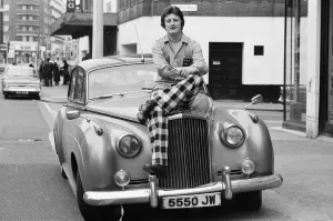 01164 Prints: Nineteen year old dart player Eric Bristow poses in London sitting on top of a Rolls
