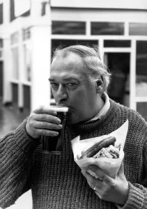 Nobby Clarke enjoys tucking into sausage and chips and a pint at his local The Railway