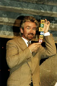 00126 Prints: Noel Edmonds Tv Presenter with some National Lottery numbers