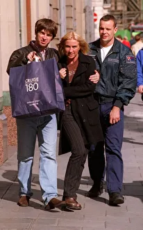 Noel Gallagher of the pop group Oasis with his girlfriend Meg Matthews outside