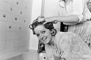 Bathroom Prints: The Nolan sisters at home in Ilford. Bernadette helps Linda to wash her hair
