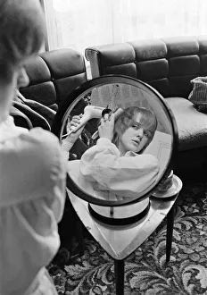 Bernie Prints: The Nolan sisters at home in Ilford. Bernadette is pictured doing her hair