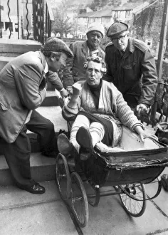 Nora Batty (played by Kathy Staff) gets a ride in the pram from Norman Clegg