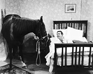 Norman Wisdom Comedian Actor with Nellie the Horse in a scene from the film