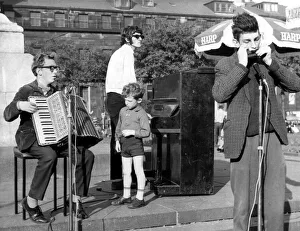 Amazement Prints: North East Festivals Crowds are treated to a musical treat by an amateur trio
