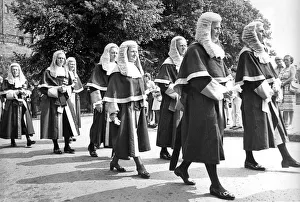 North judges walk in procession across Palace Green wearing their wigs