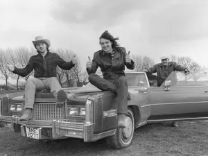 North rock band Battle-Axe, Singer Dave King (centre) shows off the Cadillac to