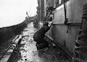 00035 Prints: North Sea trawlerman takes cover as a German Heinkel 111 strafes the trawler Star of