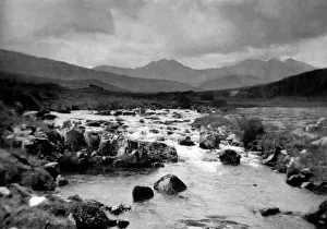 00043 Prints: North Wales a turbulent stream races towards the sea with Snowdon dominating