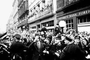 00396 Prints: Northern Premier of A Hard Days Night'. Fans line up along the streets in