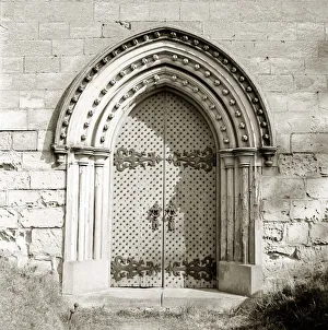 Arch Prints: Norton Church Studded siege doors Norman Door Wall of building with