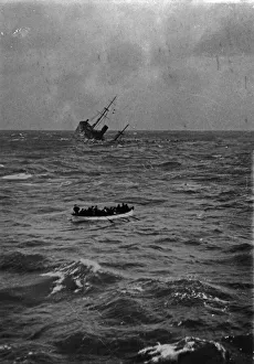 Convoy Prints: The Norwegian cargo ship Burgos seen here sinking after she struck a mine in the North