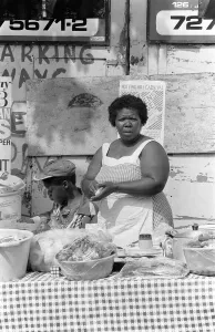 00151 Prints: Notting Hill Carnival 1981 Residents take part in selling food for the carnival