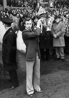 Nottingham Forest captain John McGovern shows off the League cup trophy to the crowd