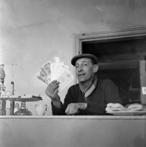 Banknotes Prints: Notts Forest fan with his unwanted FA cup semi final tickets for sale. March 1959