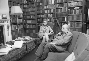 Novelist Prints: Novelist J. B. Priestley in the library of his home with his wife Jacquetta Hawkes