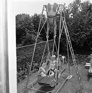 Fairground Prints: A novelty acrobatic machine has been devised by The Amazing Briton