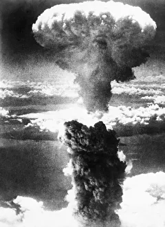 The nuclear mushroom cloud rising over the Japanese city of Nagasaki following