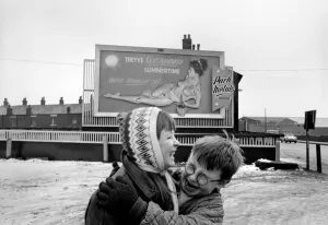 Nude poster story. Two youngsters, out playing in the snow sniggering after seeing