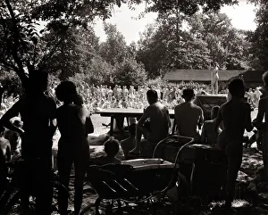 Nudist Beauty Contest - August 1957 people gather round a stage to view contestants