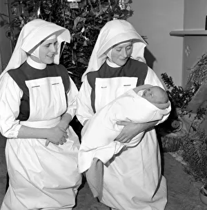Nuns. Nursing sisters seen here with baby Noel born Christmas Day. December 1953 D7672