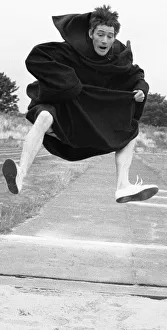 Long Jump Prints: The Nuns Olympics. Actor Richard Eden seen here taking part in the monk