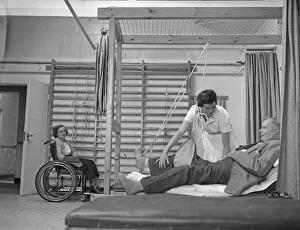 A nurse demonstrates how a sling for a broken leg works during a open day at the Chester