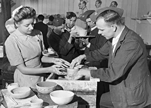 Wounded Prints: Nurse Pat Tait instructs wounded troops in curative pottery at a workshop for injured