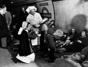 Shelter Prints: Nurses giving tube shelterers Garole for prevention of flu as they take cover in at St
