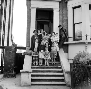 Front Door Prints: The O Brien family standing on the front steps outside their flat in New Cross