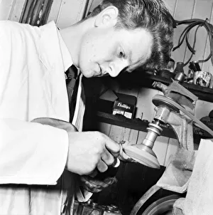 Occupations: Cobbler Mr. Steptowe seen here working at his sewing machine in his workshop