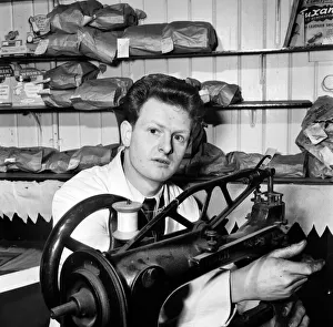 Occupations: Cobbler Mr. Steptowe seen here working at his sewing machine in his workshop