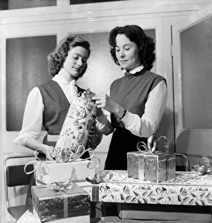 Occupations: Shop Assistants. Shop assistants seen here learning how to wrap Christmas