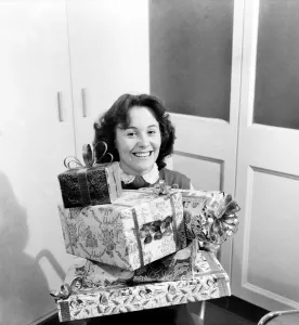 Assistant Prints: Occupations: Shop Assistants. Shop assistants seen here learning how to wrap Christmas