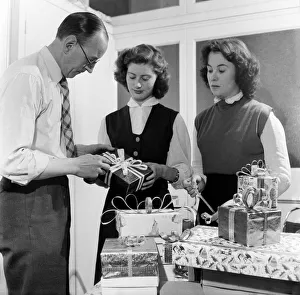Occupations: Shop Assistants. Shop assistants seen here learning how to wrap Christmas