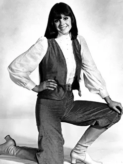 October 1970 Model kneeling on the floor wearing a pale blue cord velvet