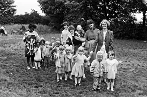 00648 Prints: Off on a 10 lap sponsored toddle around the garden at St Jamess church, Rawthorpe