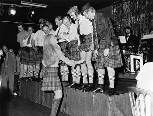 00025 Prints: Off with their trousers! A line-up of phoney Scots in the Caledonian Suite night club