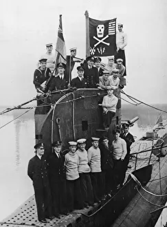 Flag Prints: Some of the officers and crew of HMS Unison seen here on deck with their jolly roger flag