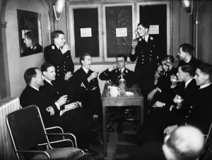 01479 Prints: Officers of HMS Ajax and Exeter enjoying a drink during the interval at the London