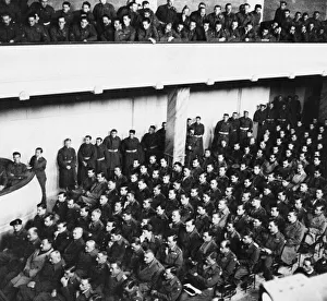 Officers and men of the 8th Army headquarters staff listen to General Montgomery