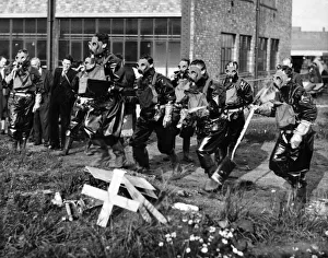 Gasmask Prints: No official caption. ARP Personnel training in bomb disposal