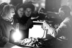 Sausages Prints: An oil lamp provides illumination at a butchers stall in the Newcastle Grainger Market