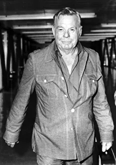 Firefighter Prints: Oil rig firefighter Red Adair firefighter arriving at Heathrow airport. May 1977