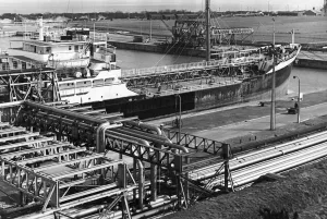 An oil tanker discharges oil at the quayside of the Queen Elizabeth II oil dock